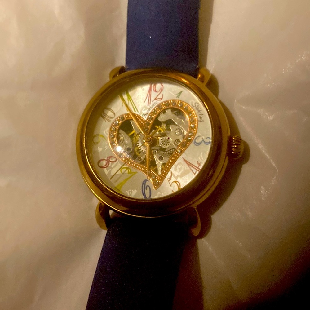 Gorgeous Stuhrling woman’s skeleton watch with several colored bands.
